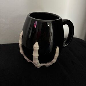 Black Mug with Skeleton Hand Design